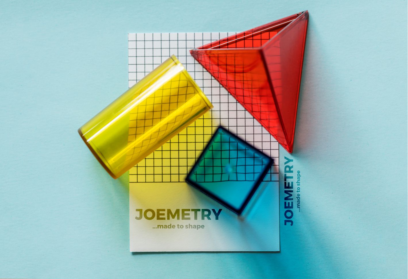 Modern design workspace with geometric shapes and brand identity elements
